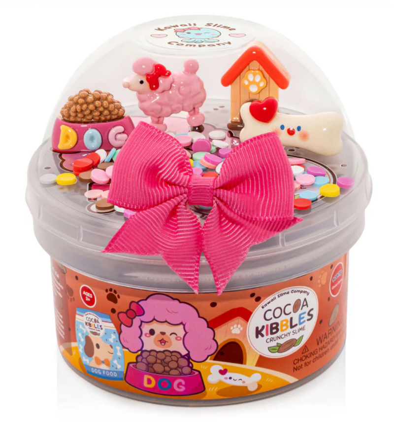 Toy container with pink bow and small dog-themed figures on a white background