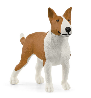 Dog figurine with brown and white color pattern on a white background